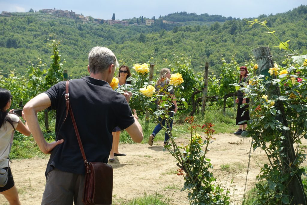 Michael smelling a rose at Terrabianca vineyard.